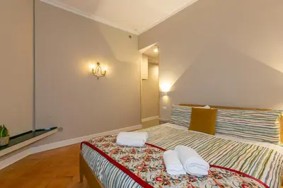 a bedroom with a bed with two pillows on it at Home Baccina 28 in Rome