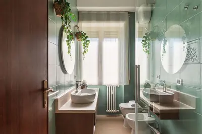 a group of bottles on a wall in a shower at Casa Incanto - Luxury Vatican Apartment in Rome