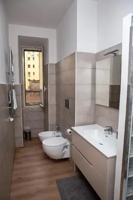 a bathroom with a toilet and a sink at Ostiense 73 in Rome