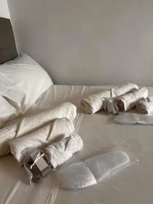 a bedroom with a large bed with white sheets at Porta Maggiore room in Rome