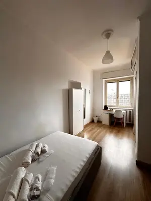 a kitchen counter with a coffee maker and a window at Porta Maggiore room in Rome