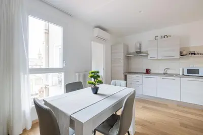 a kitchen and dining room with a table and chairs at Appartamento Lilly's Home Piazza Navona in Rome