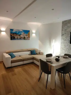 a living room with a couch and a table at Appartamento Lilly's Home Piazza Navona in Rome