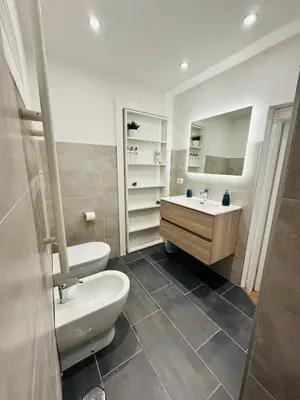 a bathroom with a toilet and a sink at Appartamento Lilly's Home Piazza Navona in Rome