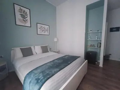 a bedroom with a large bed in a room at AD 111 ColaDiRienzo Rooms - by AD Roma in Rome