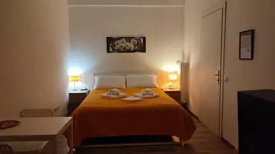 a bedroom with a bed with two towels on it at Room CasaVostrA 2 in Rome