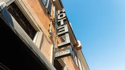 a sign that says spa on the side of a building at Hotel Center 3 in Rome
