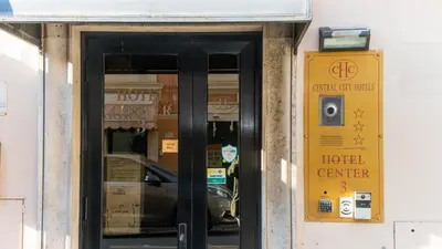 a door to a hotel center with a sign at Hotel Center 3 in Rome