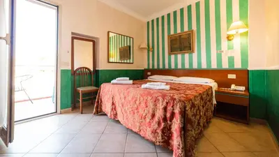 a hotel room with a bed and a window at Hotel Center 3 in Rome