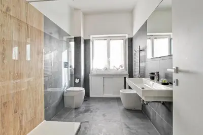 a bathroom with a toilet and a sink at Marble Rooms in Rome