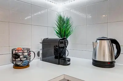a kitchen counter with a toaster and a coffee maker at Casa San Paolo in Rome