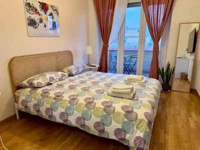 a bedroom with a bed with a view of the ocean at San Paolo Corner in Rome