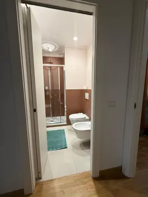 an open door to a bathroom with a toilet at San Paolo Corner in Rome
