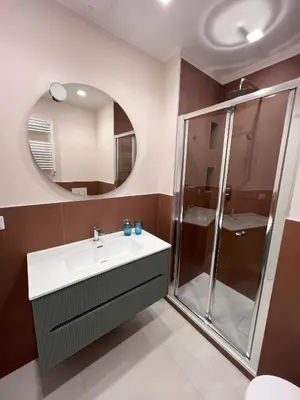 a bathroom with a sink and a shower at San Paolo Corner in Rome
