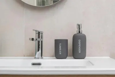 two bottles ofodorizers sitting on a bathroom sink at Zen Vatican Studio - Zen 30 in Rome