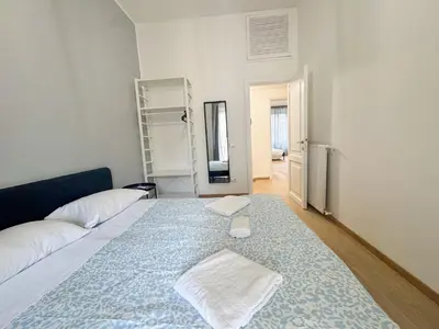 a room with a bed with a towel on it at Mocenigo Boutique Apartment in Rome