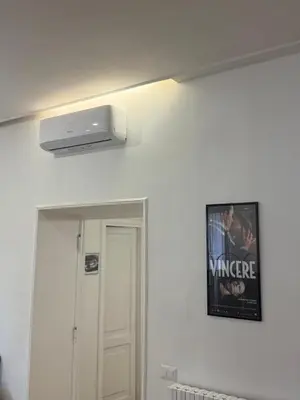 a picture of a movie hanging on a wall at Mocenigo Boutique Apartment in Rome
