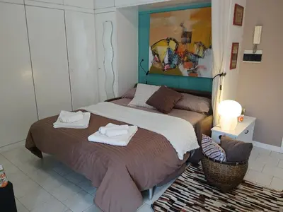 a bedroom with two beds with towels on them at Casetta Maria Pia near Metro A Cornelia in Rome