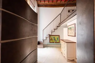 a hallway with a staircase and a counter in a house at Navona Stylish Apartment - Up to 5 People in Rome