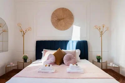 a bedroom with a bed with two pillows on it at Appartamento Via XXIV Maggio in Rome