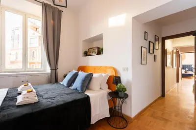 a bedroom with a bed and a window at Appartamento Via XXIV Maggio in Rome