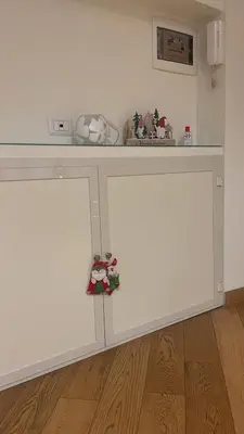 a white cabinet with a counter top in a room at Casetta via delle Cave in Rome