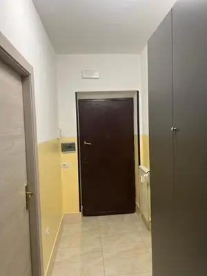 a black door in the middle of a hallway at TURATI TERMINi in Rome