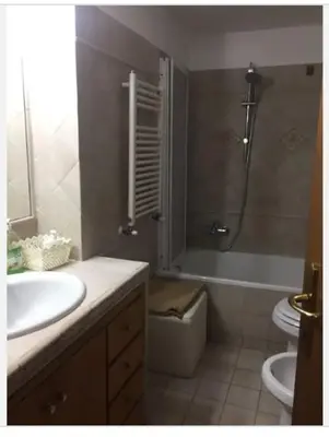 a bathroom with a sink and a shower and a toilet at Casa Adry in Rome
