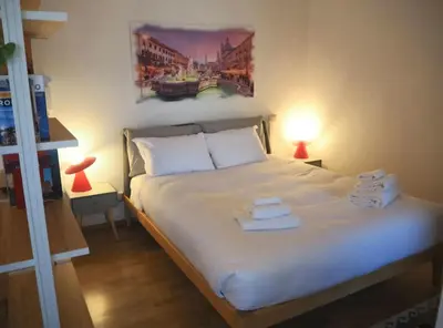 a bedroom with a bed with towels on it at Casa Aurelia 641 in Rome