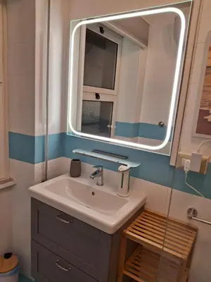 a bathroom with a sink and a mirror at Casa Aurelia 641 in Rome