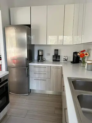 a kitchen with a stainless steel refrigerator and a sink at Home34 in Rome