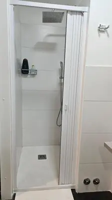 a shower with a glass door in a bathroom at DidiHouse in Rome