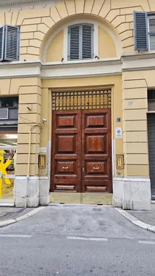 a building with a large wooden door on it at DidiHouse in Rome