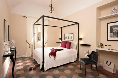a bedroom with a bed with a large mirror at Emperor's View in Colosseum in Rome