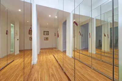 a hallway with glass partitions in a building at A casa, Aventino in Rome