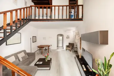 a living room with a couch and a table at Navona Charming Apartment by Romeloft in Rome