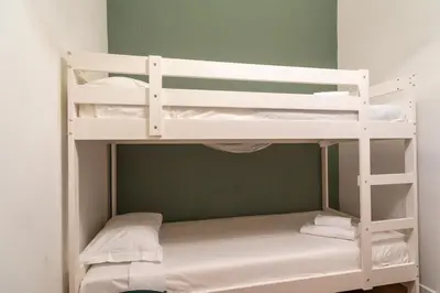 a white bunk bed in a room at Flower Fields Home - Appartamento Campo dei Fiori in Rome