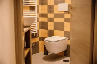 a bathroom with a toilet and a sink at Dea Suites Two in Rome