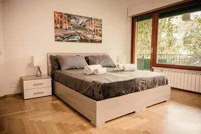 a bedroom with a bed with two towels on it at Dea Suites Two in Rome