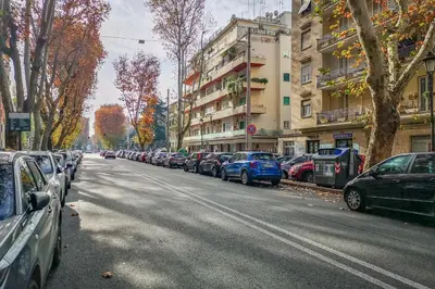 a row of cars parked on the side of a street at DOMUS LUX ANGELICA- Nearby Vatican in Rome