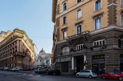 a city street with buildings and cars parked on the street at GuestHost - Central and Modern apartment in Rione Monti in Rome
