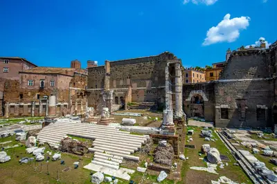 an aerial view of the ruins of a building at Empire Loft in the shadow of Colosseum in Rome