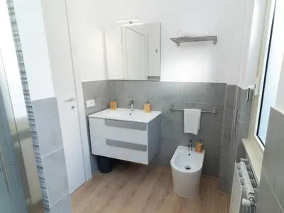 a bathroom with a sink and a toilet at Alloggio Roma San Pietro da Silvia in Rome