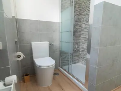 a bathroom with a toilet and a glass shower at Alloggio Roma San Pietro da Silvia in Rome