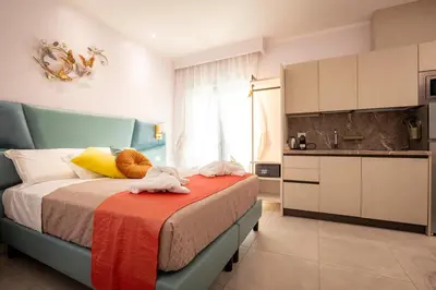 a bedroom with a bed with towels on it at Twins Royal Suite in Rome