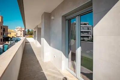 a balcony with a view of a building at Twins Royal Suite in Rome