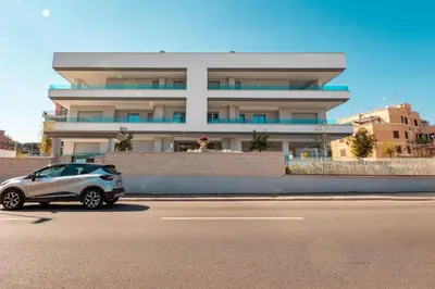 a small car parked in front of a building at Twins Royal Suite in Rome