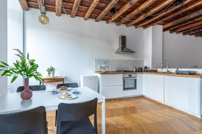 a kitchen and dining room with a table and chairs at Iflat Cozy Studio in the Heart of Campo de Fiori in Rome