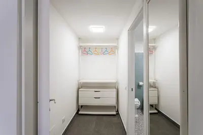 a bathroom with a toilet and a mirror at Casina Bianca in Rome