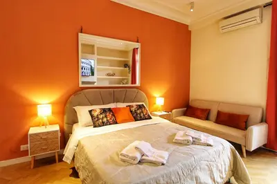 a bedroom with a bed with two towels on it at Domus Mazzini in Rome
